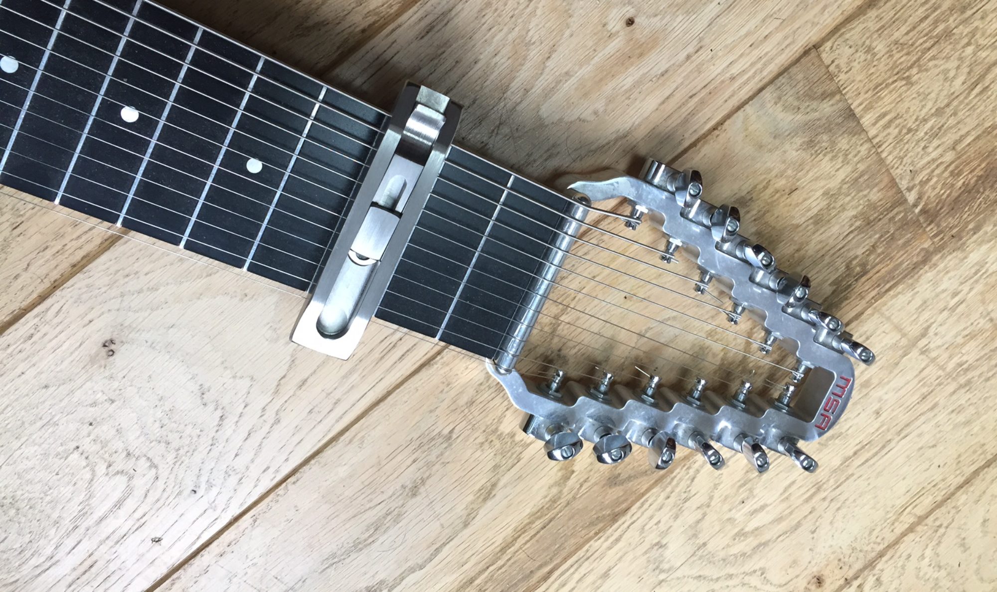 croppedlapsteelcapo4.jpg Charlie's Slide Pro Capos